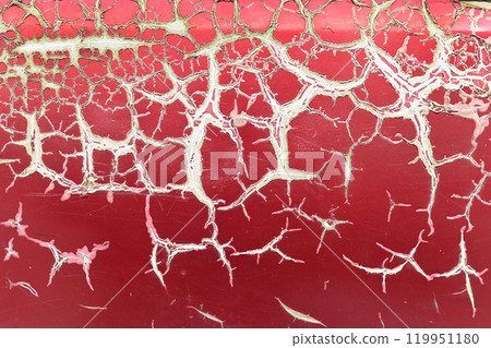Texture or background of the metal wall is painted red with rust. and has corrosion, damage, chipping and peeling. 119951180