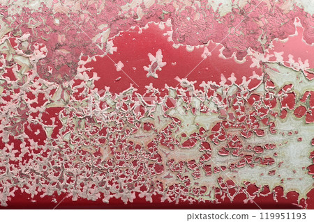 Texture or background of the metal wall is painted red with rust. and has corrosion, damage, chipping and peeling. 119951193