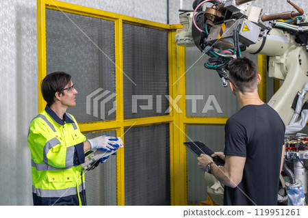 Technician engineer using laptop control automation robotics at industrial modern lab factory. male team technological researching and developing working at factory innovation automation robot. Technician engineer using laptop control automation robotics at industrial modern lab factory. male team technological researching and developing working at factory innovation automation robot. 119951261