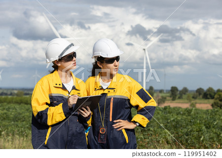 Female engineer wind turbine worker survey operational planning windmill clean renewable energy technology for future. Alternative technology protect environment reduce global warming problems. 119951402