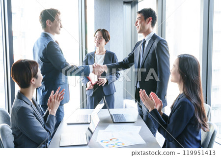 A businessman shaking hands in the office A businessman shaking hands in the office 119951413