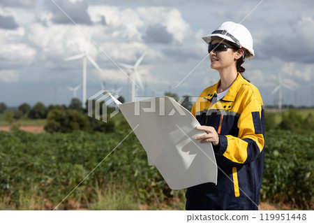 Female engineer wind turbine worker survey operational planning windmill clean renewable energy technology for future. Alternative technology protect environment reduce global warming problems. Female engineer wind turbine worker survey operational planning windmill clean renewable energy technology for future. Alternative technology protect environment reduce global warming problems. 119951448