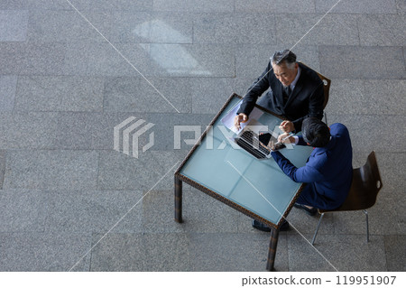 Top view, Asian multi generation business men wear suit working together. Senior and young businessman discussing agreements to meetings with partners and connections. Discuss business strategy. 119951907