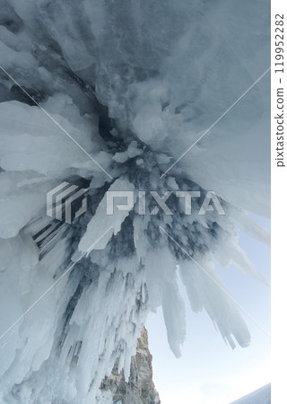 The freezing of the water in Lake Baikal has created ice caves in the rocks around Olkhon Island. This landscape only exists from mid-January to early April. Located at Irkutsk Oblast , Russia. 119952282