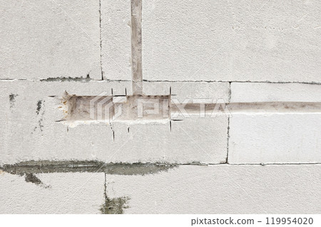 Electric Socket Hole on Lightweight Concrete Wall. Electric Socket Hole on Lightweight Concrete Wall. 119954020