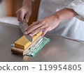 Chef sharpening a knife 119954805