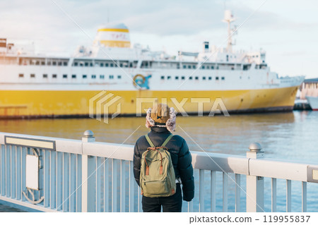 Woman tourist sightseeing Aomori Bay Bridge area with the Hakkodamaru Memorial Ship, Traveler travel in Aomori city, Aomori Prefecture, Japan. Landmark for tourist attraction, travel and vacation 119955837