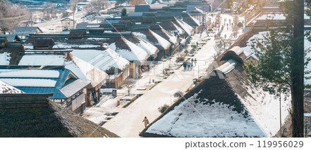 Ouchi Juku ancient farmer house village with snow in winter, former post town along the Aizu-Nishi Kaido trade route during the Edo Period. Shimogo town, Minamiaizu, Fukushima Prefecture, Japan Ouchi Juku ancient farmer house village with snow in winter, former post town along the Aizu-Nishi Kaido trade route during the Edo Period. Shimogo town, Minamiaizu, Fukushima Prefecture, Japan 119956029
