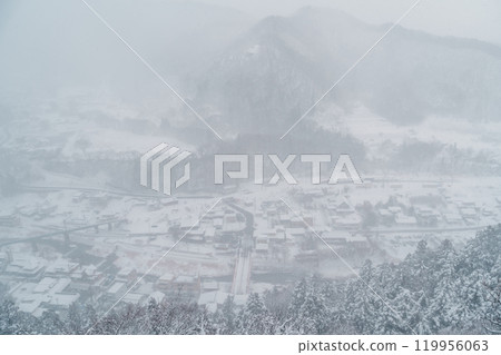 view of village with snow in winter from mountain viewpoint of Yamadera temple, the popular name for the Buddhist temple of Risshakuji located in Yamagata City, in Yamagata Prefecture, Tohuku, Japan 119956063