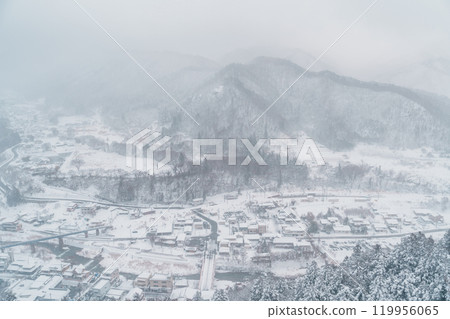 view of village with snow in winter from mountain viewpoint of Yamadera temple, the popular name for the Buddhist temple of Risshakuji located in Yamagata City, in Yamagata Prefecture, Tohuku, Japan 119956065