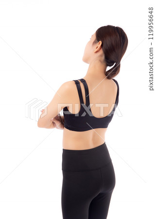 Portrait of beautiful young asian woman in sportswear and crossed arms isolated. 119956648