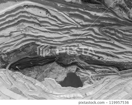 Monochrome panorama of a coal quarry with multi-level roads for trucks 119957536