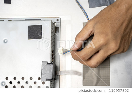 Man technician plug the television socket 119957802