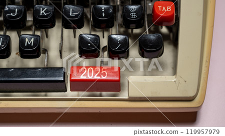 Top view of 2025 number written on typewriter button Top view of 2025 number written on typewriter button 119957979