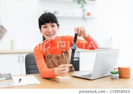 Caucasian female blogger reviews smartwatch in home office setup Caucasian female blogger reviews smartwatch in home office setup 119958053