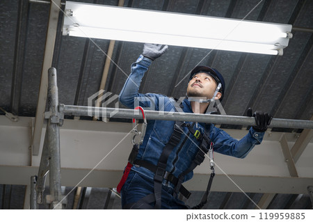 Electricians and workers working at height, performing electrical inspections, etc. 119959885