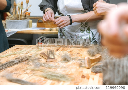 Crafting natural fibers at artisanal workshop for creative handmade projects Crafting natural fibers at artisanal workshop for creative handmade projects 119960098