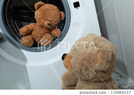 Teddy Bears Lovingly Observing a Washing Machine in a Cozy Home Scene Filled with Joy Teddy Bears Lovingly Observing a Washing Machine in a Cozy Home Scene Filled with Joy 119960157