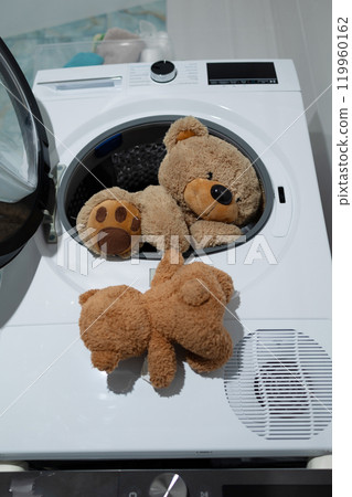 Teddy Bears Being Washed in a Washing Machine Makes for a Fun and Adorable Scene 119960162