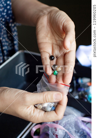 Hand Picking Beads from a Selection for Craft Project Hand Picking Beads from a Selection for Craft Project 119960205