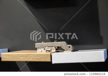 Modern Cabinet Hinge on Wooden Board Modern Cabinet Hinge on Wooden Board 119960216