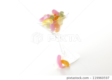 Jelly beans in a cocktail glass photographed on a white background 119960597