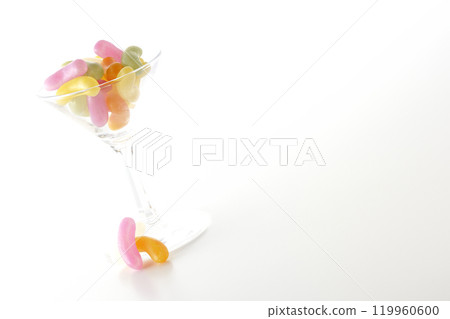 Jelly beans in a cocktail glass photographed on a white background Jelly beans in a cocktail glass photographed on a white background 119960600