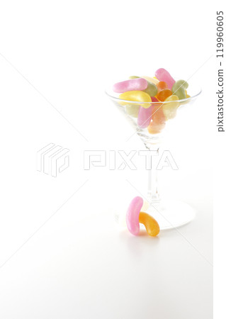 Jelly beans in a cocktail glass photographed on a white background 119960605