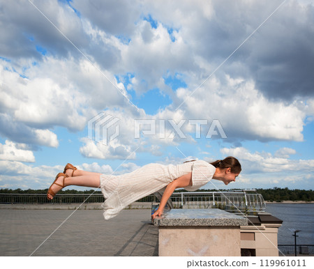 Girl in the city did a horizontal handstand 119961011