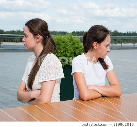 The girls look in different directions with resentment The girls look in different directions with resentment 119961016