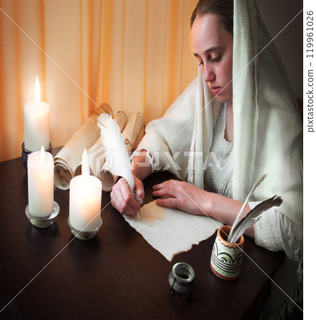 Woman write letter on vintage paper for writing on wooden table 119961026