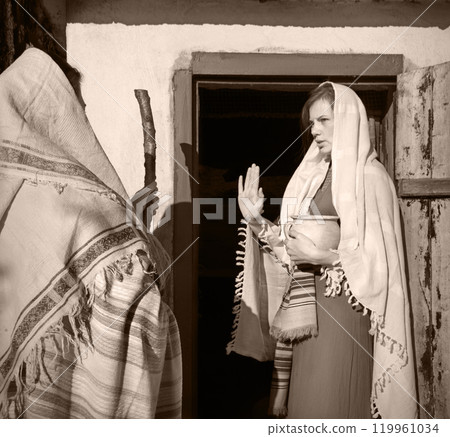 Girl in the door of her home Girl in the door of her home 119961034