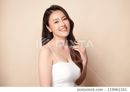Beautiful young asian woman with clean fresh skin on beige background, Face care, Facial treatment, Cosmetology, beauty and spa, Asian women portrait. 119962161