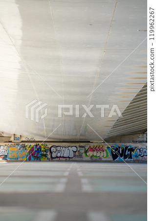 the wall is covered with graffiti painting 119962267