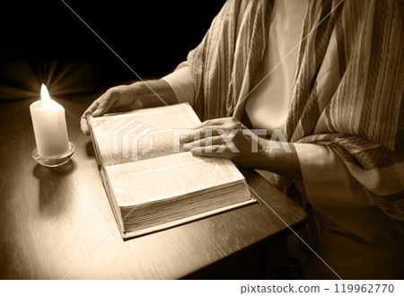 Man reading an old bible Man reading an old bible 119962770