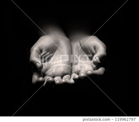 Asking hands on black backdrop 119962797