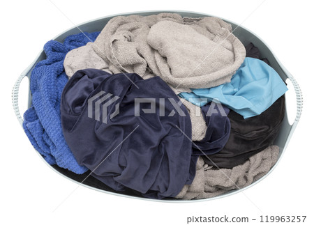 Laundry basket filled with assorted clothes in various colors, isolated on white background. Top view. Ideal for themes related to laundry, household chores, or textile care. Cut out clothing. Laundry basket filled with assorted clothes in various colors, isolated on white background. Top view. Ideal for themes related to laundry, household chores, or textile care. Cut out clothing. 119963257