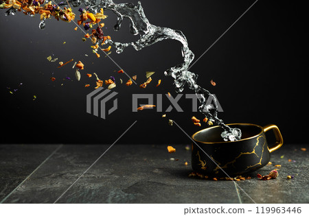 Ingredients for making herbal tea are poured into a mug. Ingredients for making herbal tea are poured into a mug. 119963446