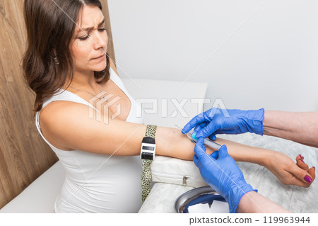 Pregnant woman undergoing blood test during routine check-up for maternal health Pregnant woman undergoing blood test during routine check-up for maternal health 119963944
