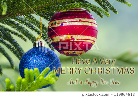Merry Christmas and Happy New Year Wishes with Christmas ball and pine tree background. Holiday Season Concept 119964618