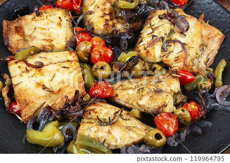 Baked mackerel stuffed with vegetables. Baked mackerel stuffed with vegetables. 119964795