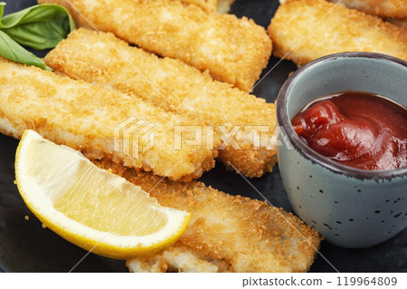 Crispy fish strips with sauce. 119964809
