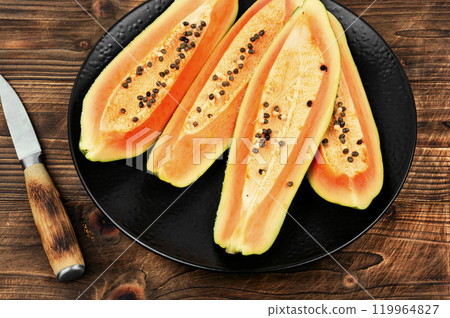 Raw fresh papaya. 119964827