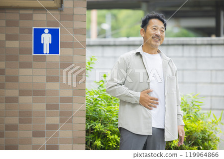 Public toilet and middle-aged man 119964866