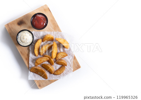 Fried potato wedges with sauces isolated on white background. Fried potato wedges with sauces isolated on white background. 119965326