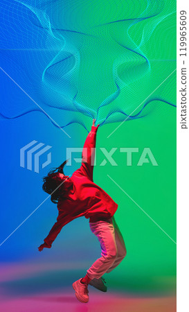Creative design. Dynamic dance of young woman in casual clothes dancing hip hop on gradient blue green background with abstract neon flow elements. 119965609