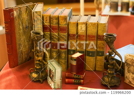 Belarus, the city of Gomel, on November 16, 2017. Ancient books of the eighteenth century. Ancient literature. Still life from rare old books Belarus, the city of Gomel, on November 16, 2017. Ancient books of the eighteenth century. Ancient literature. Still life from rare old books 119966200