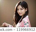 Side portrait of a woman wearing a floral kimono 119966912