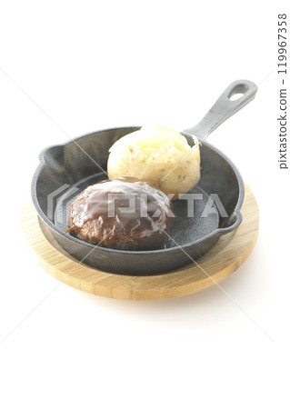 Hot hamburger steak and hot buttered potatoes photographed on a white background Hot hamburger steak and hot buttered potatoes photographed on a white background 119967358