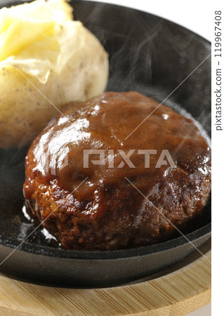 Hot hamburger steak and hot buttered potatoes photographed on a white background Hot hamburger steak and hot buttered potatoes photographed on a white background 119967408